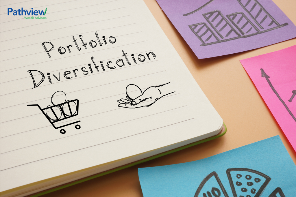 Notebook with the words “Portfolio Diversification” handwritten beside investment-themed illustrations, including a shopping cart, a hand holding an egg, and colorful sticky notes featuring growth charts and pie chart graphics.